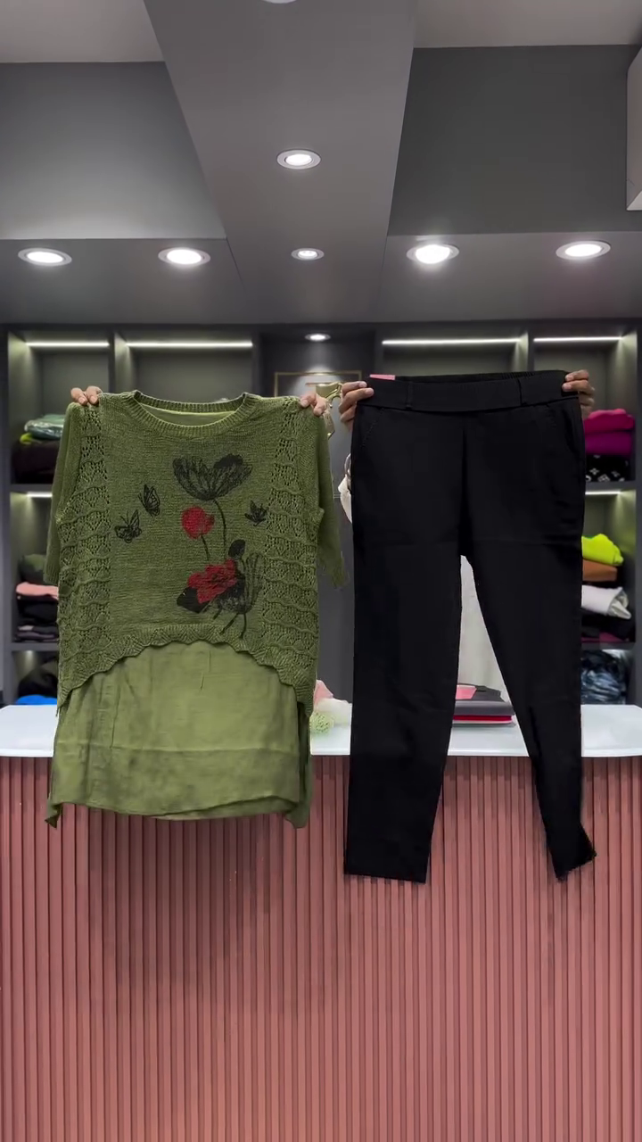 Black Open-Knit Top with Floral Appliqués and Gray Pants - Image 5