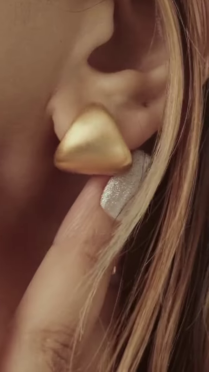 Close-Up of Stylish Gold-Toned Earrings: Teardrop, Stud, and Mesh Hoop - Image 6