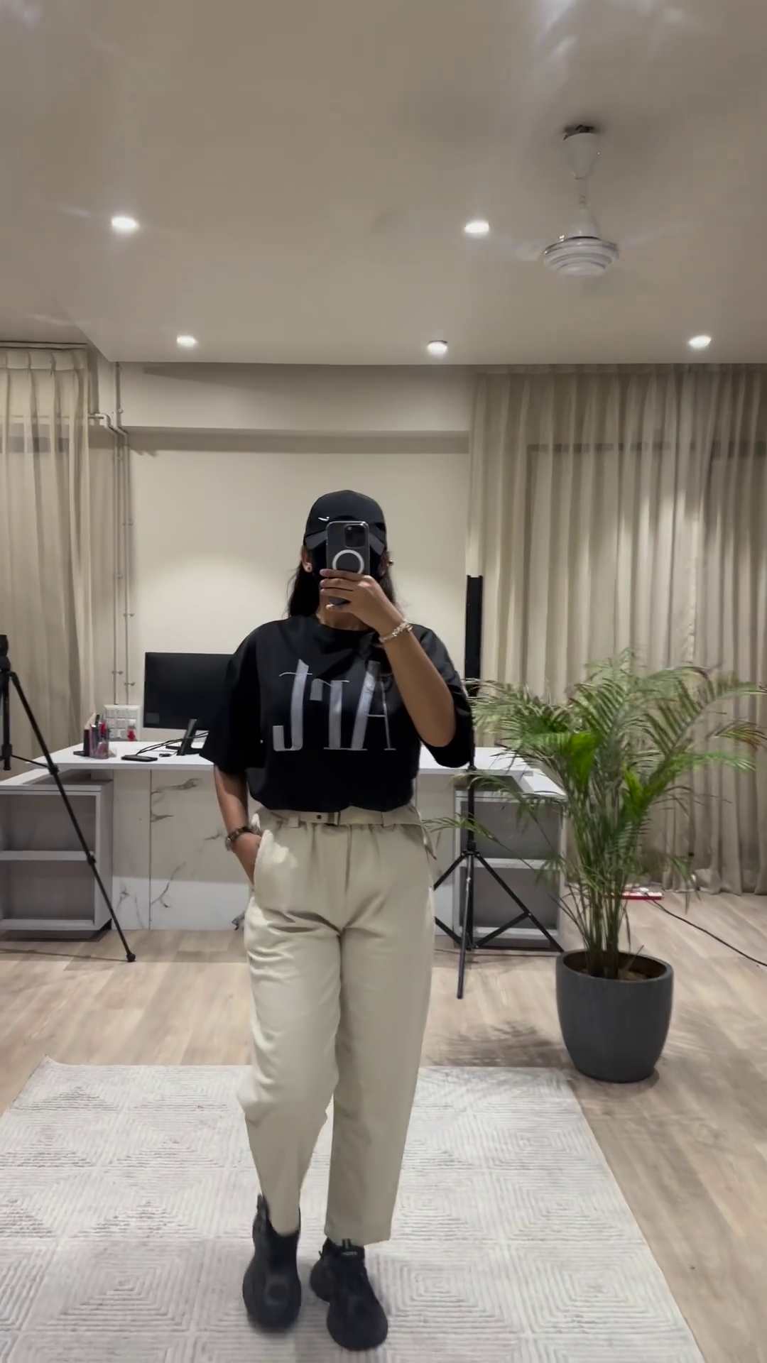 Casual Chic Outfit: White Graphic Tee, Maroon Wide-Leg Pants, and Black Cap - Image 2