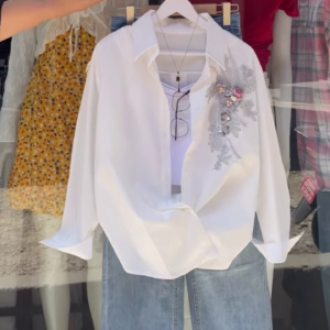 Embroidered White Shirt and Light-Wash Denim Ensemble