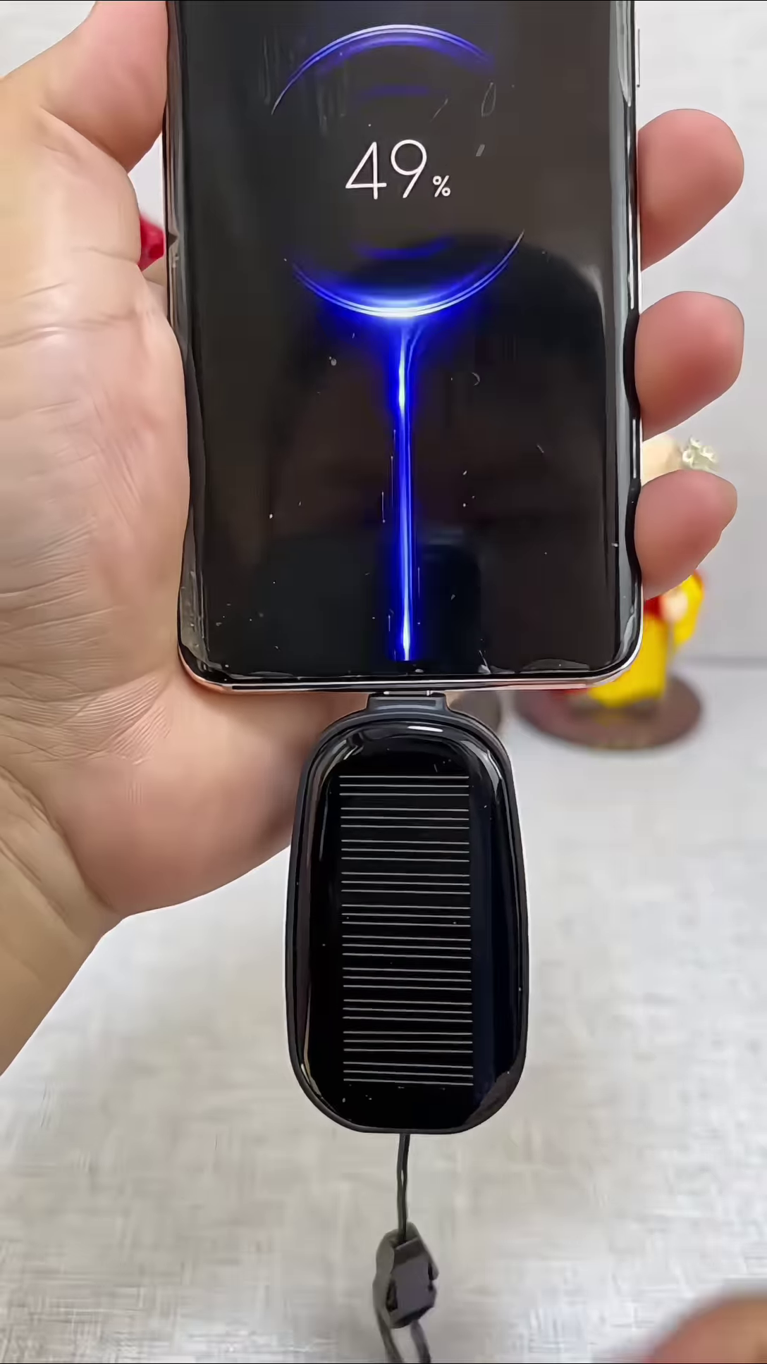 Compact Solar Powered Mobile Device Charger - Portable Energy Solution for Smartphones