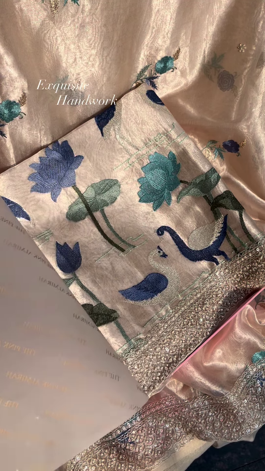 Close-Up of Exquisite Silk Fabric with Hand-Embroidered Lotus and Swan Motifs